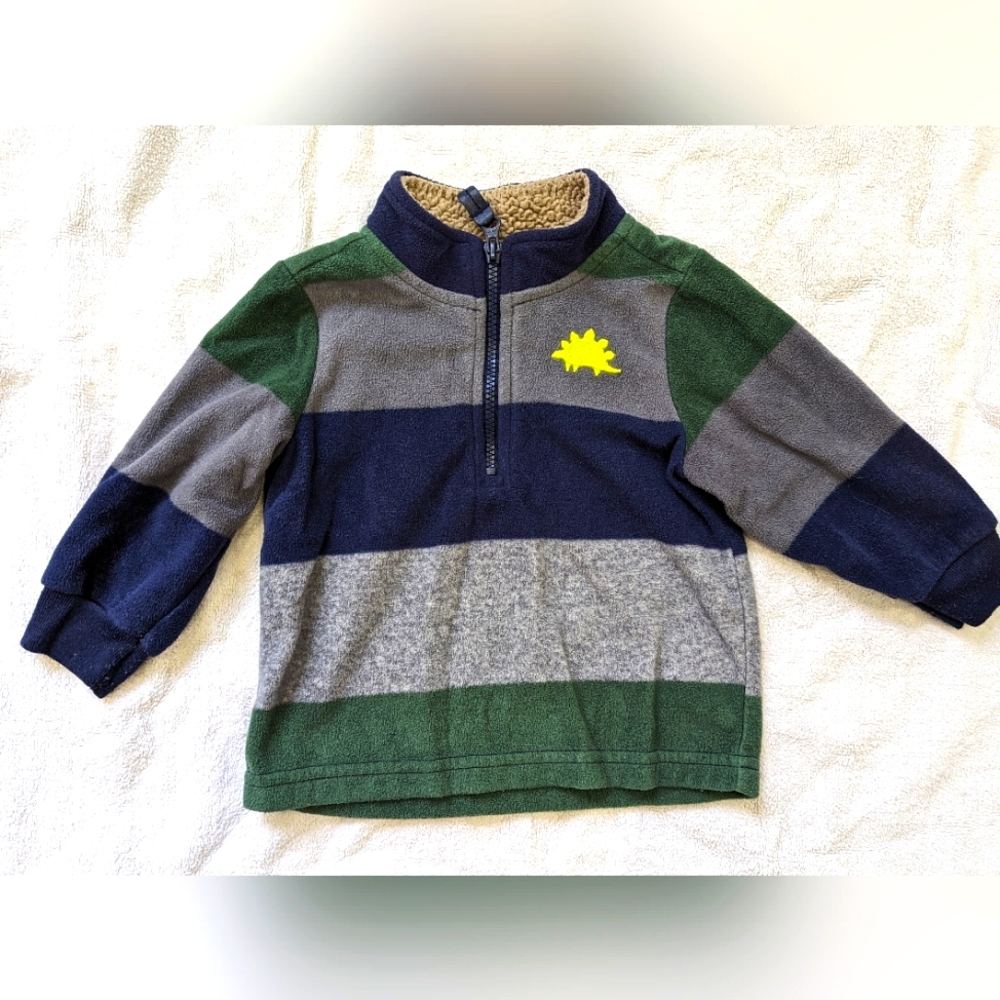 6/$22. 6-9 month striped pullover. Dino on front with zipper. Child of mine.
